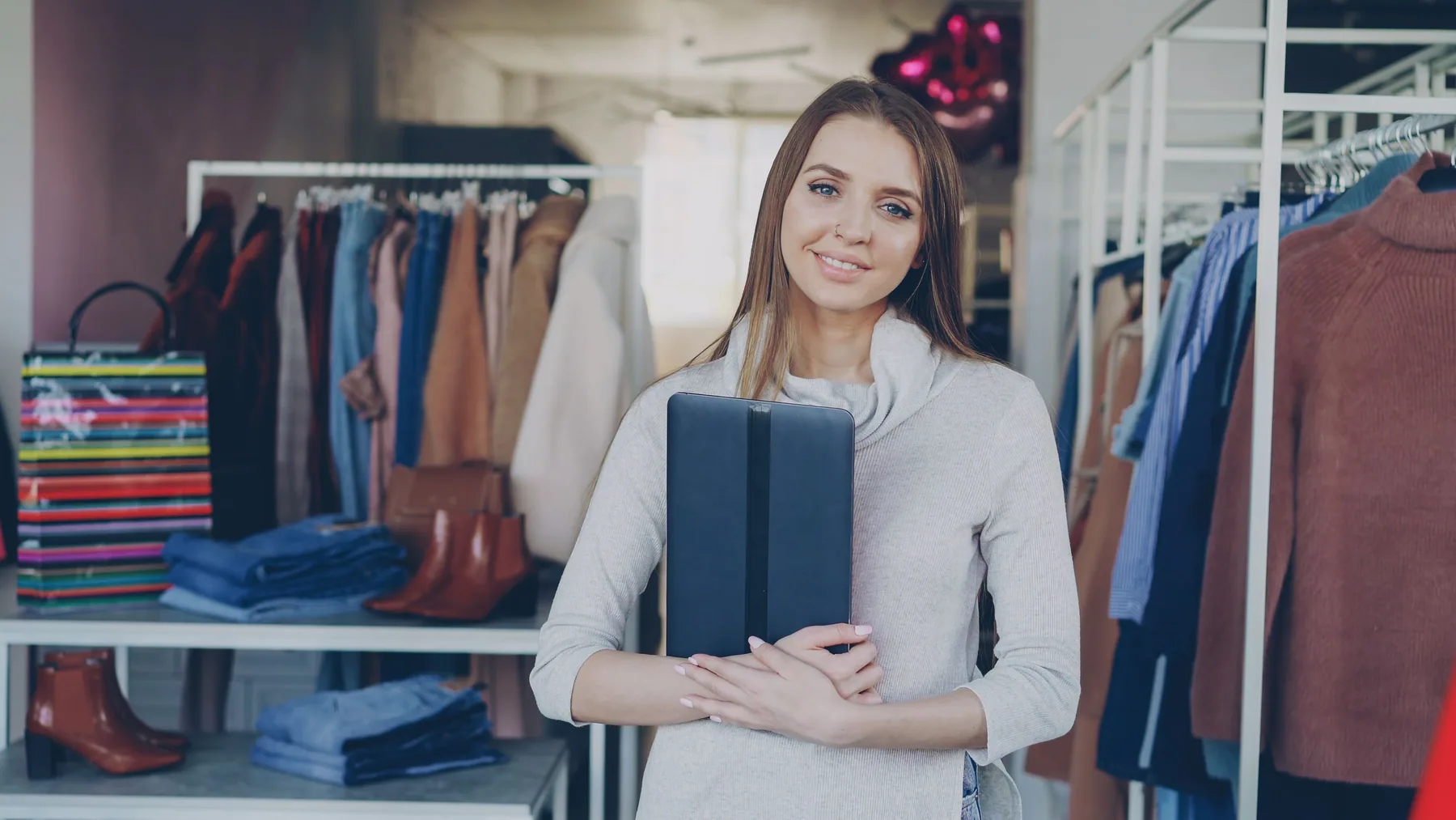An independent business owner using a tablet inside the shop.