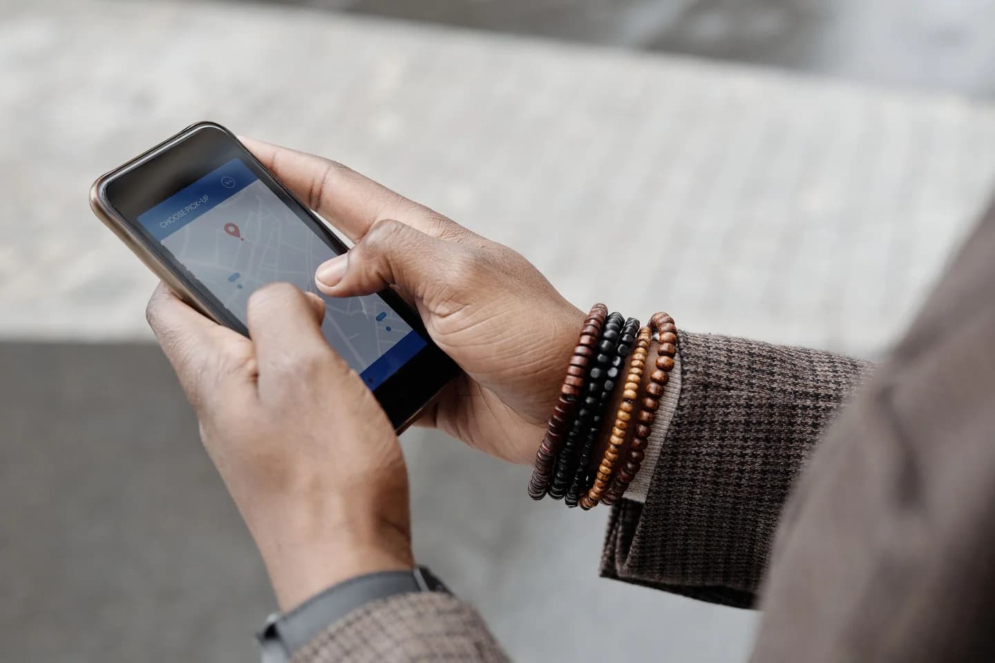 A person using a map and location pin on a smartphone.