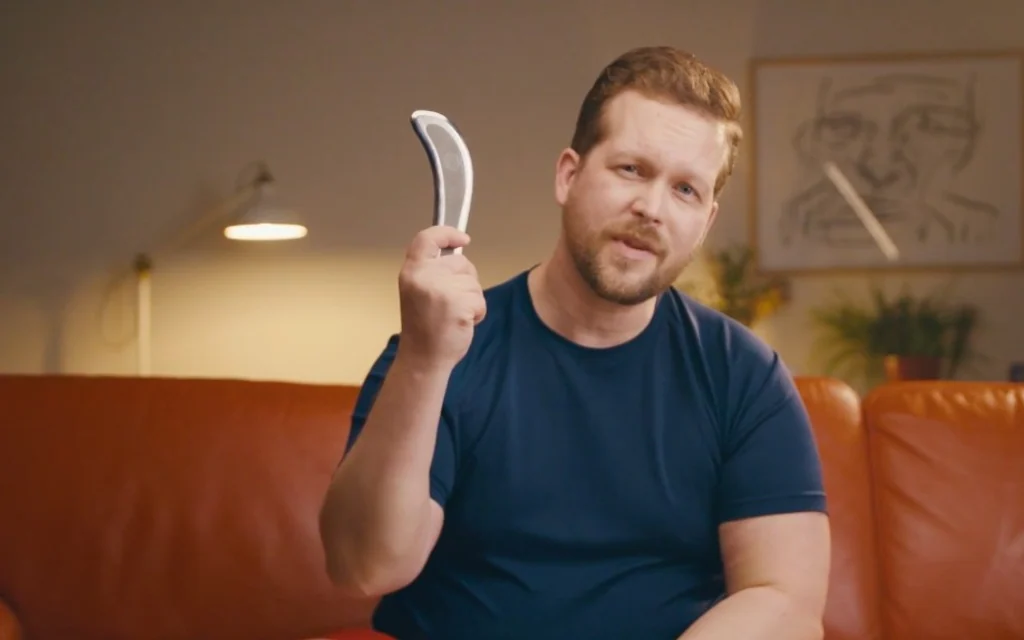 A Sidekick Tool campaign presenter holding the recovery product.